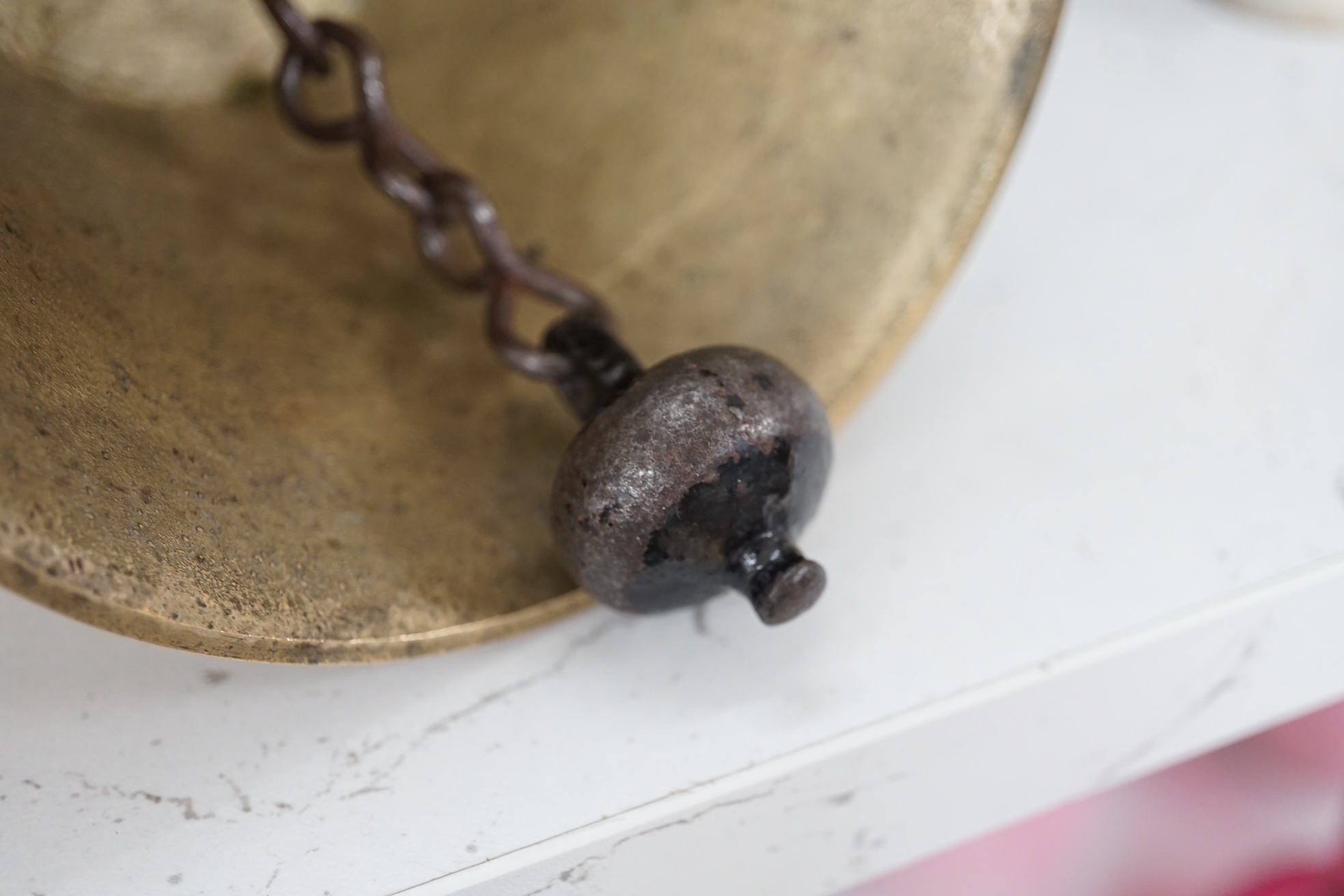 A late 19th/early 20th century brass school bell, with a turned mahogany handle, bell diameter 12.5cm, height 26cm. Condition - fair to good.